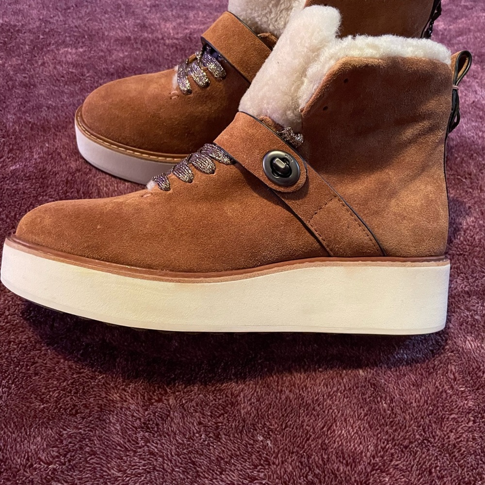 New without box or tags. Coach hiking boots.